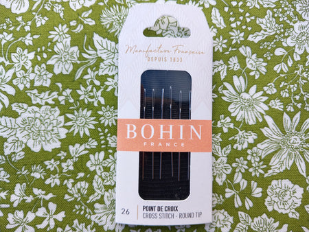Bohin needle set packaging on a floral fabric background
