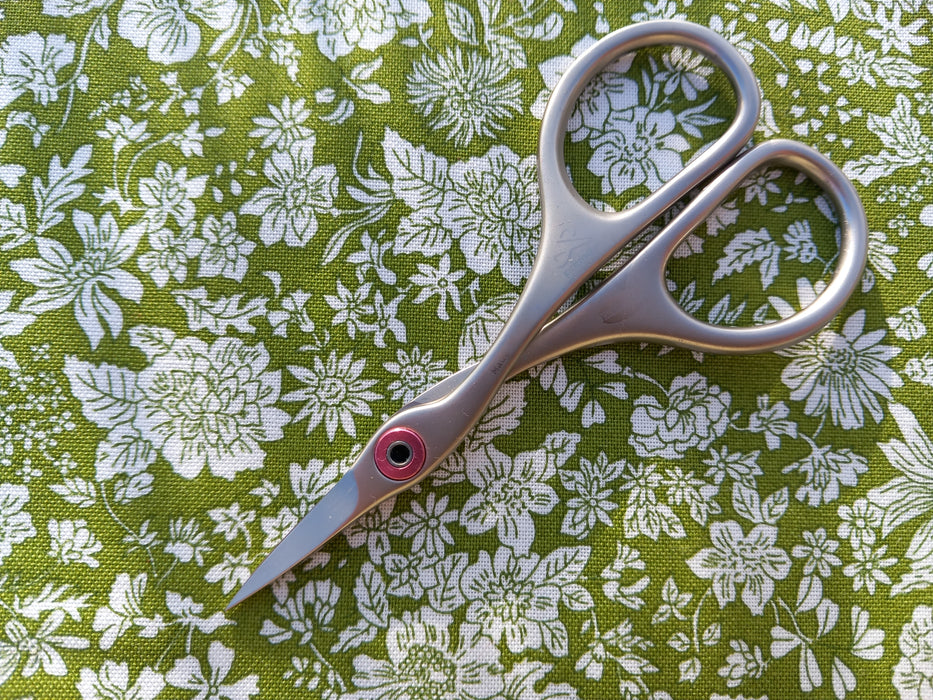 Premax embroidery scissors on floral background