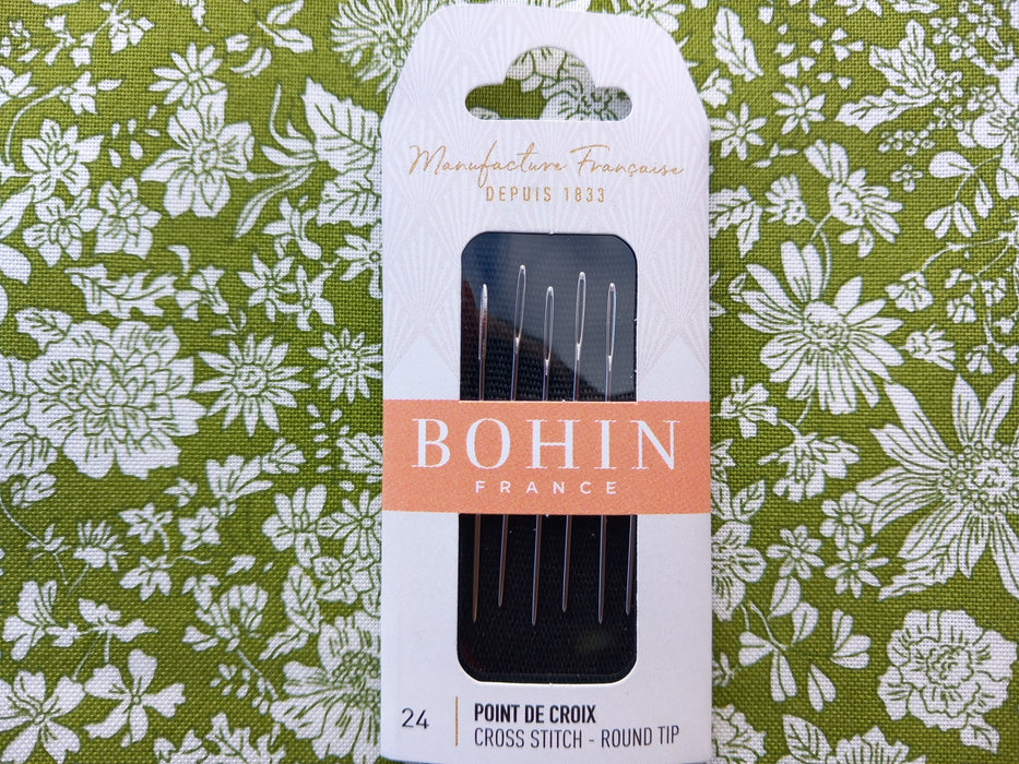 Bohin needle set packaging on a floral fabric background