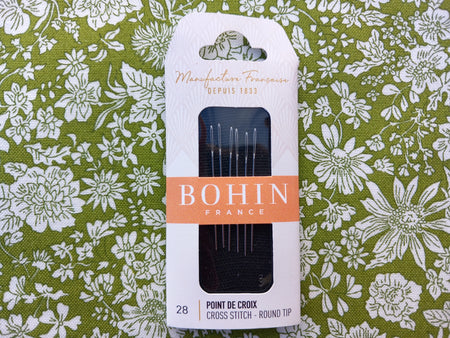 Pack of Bohin Cross-Stitch needles on floral background