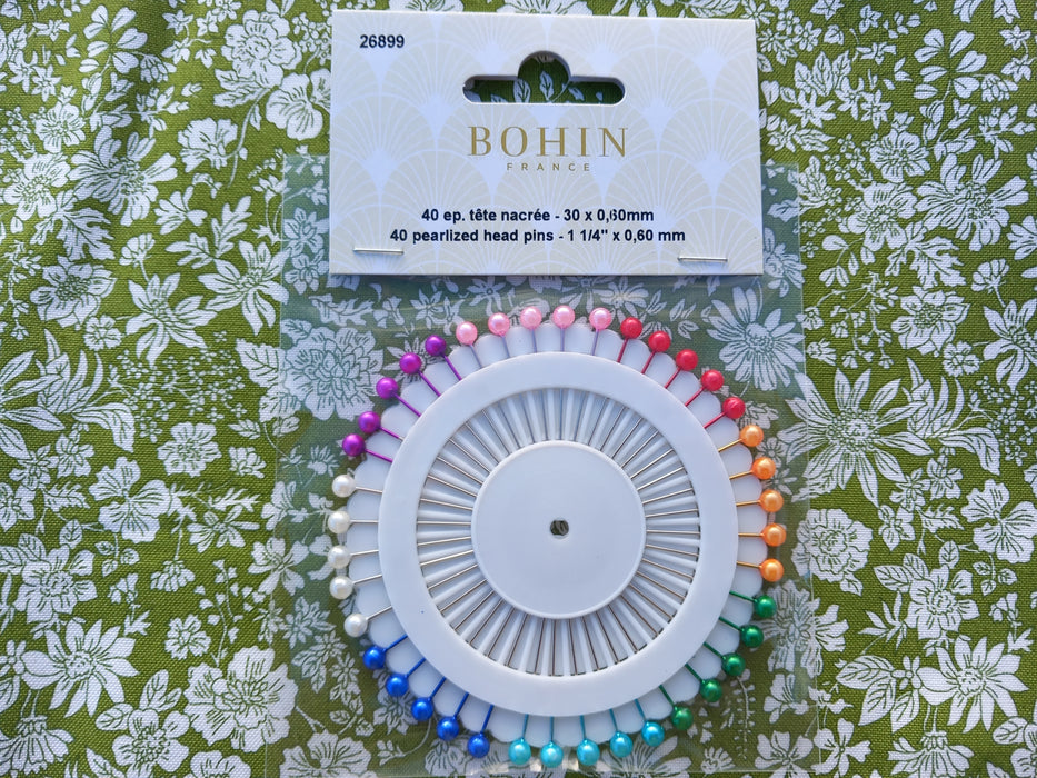 Bohin pearlized head pins on a floral background